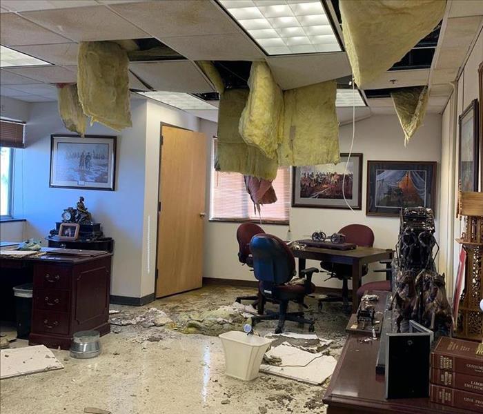 business, missing ceiling tiles, storm debris on floor
