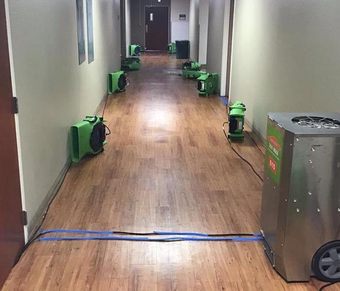 medical hallway, wet floors, green equipment
